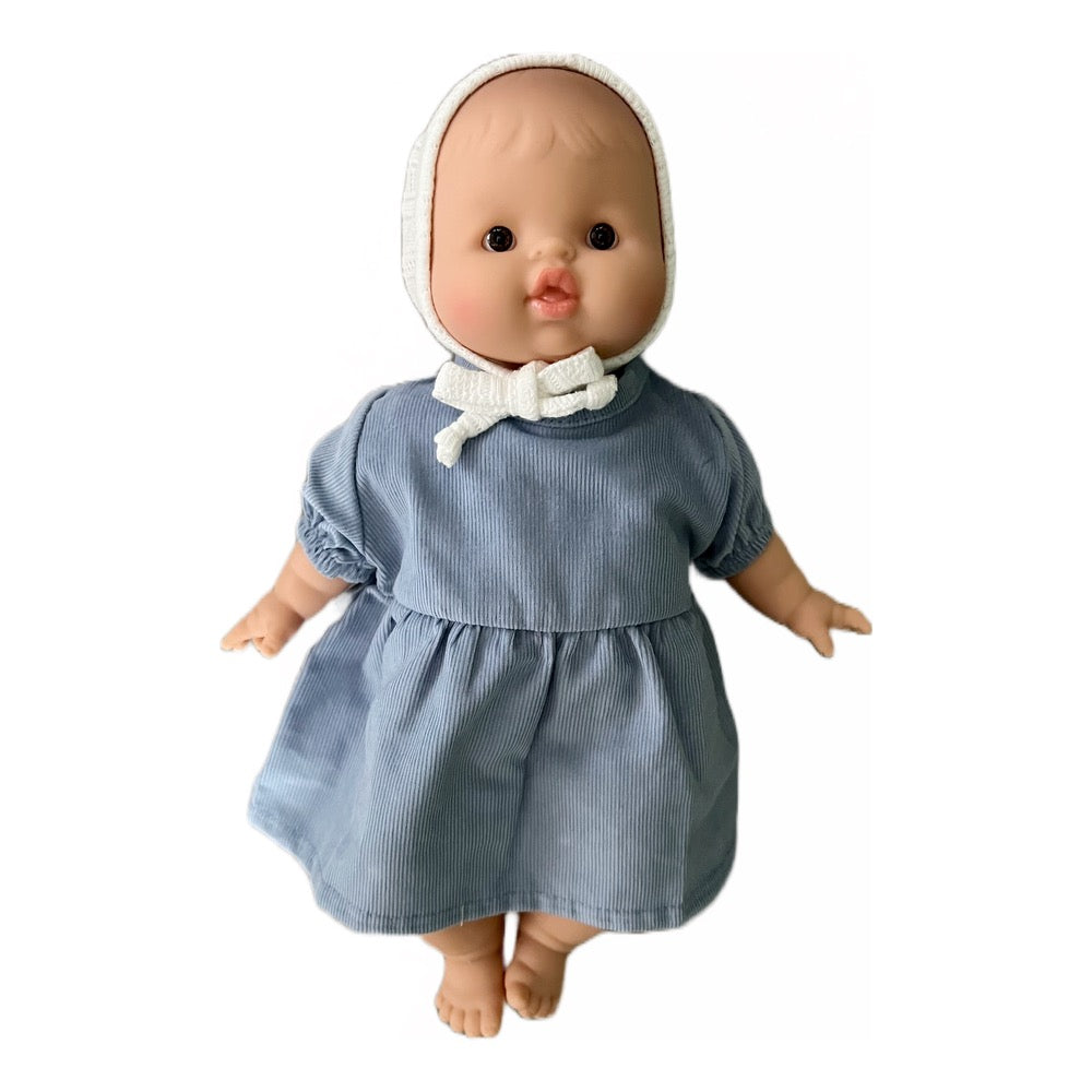 Minikane Soft Baby Girl Doll in Peacock Blue Dress and White Pointelle Bonnet · White