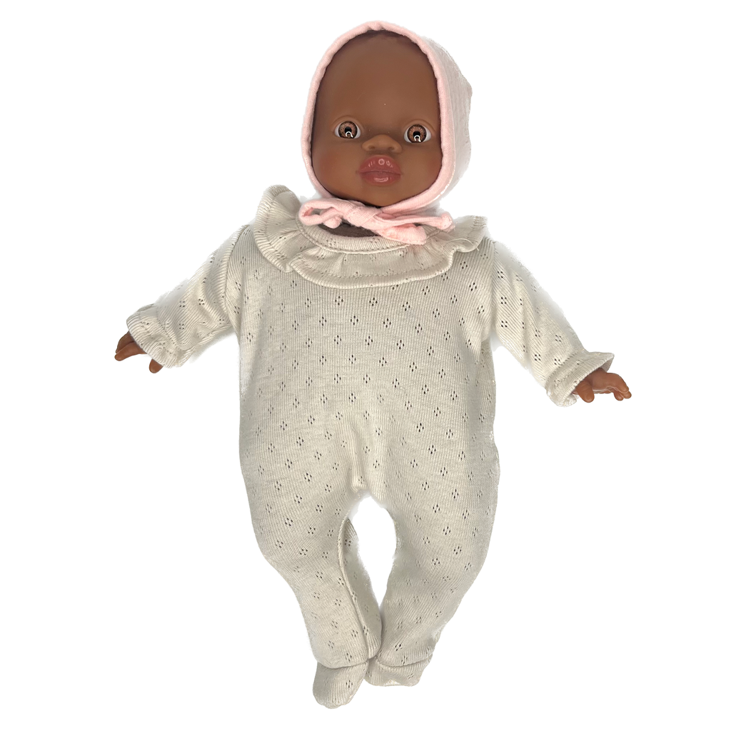Minikane Soft Baby Girl Doll in Cream Pointelle Romper and Soft Pink Bonnet · Black